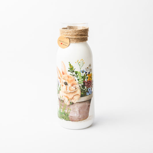 Rabbit in plant pot glass vase